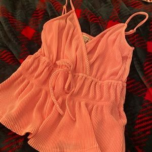 Pink blouse, size small. Adjustable straps. Clasp in front. Elastic in waist.